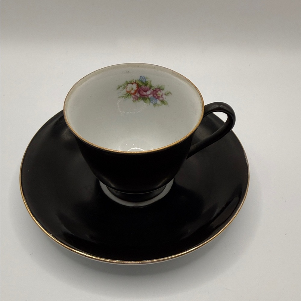 Elegant Black Floral Teacup and Saucer